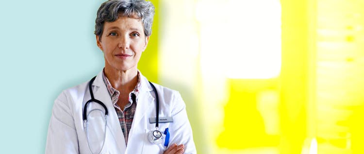 A female doctor standing with her arms crossed