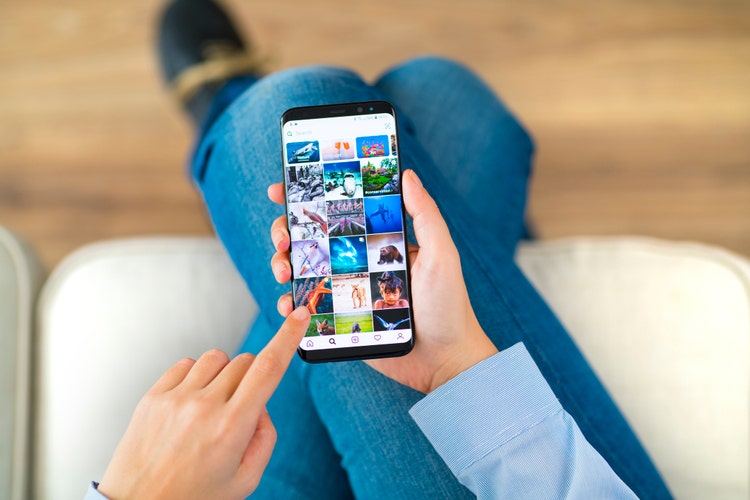 Woman looking at social media on her phone.