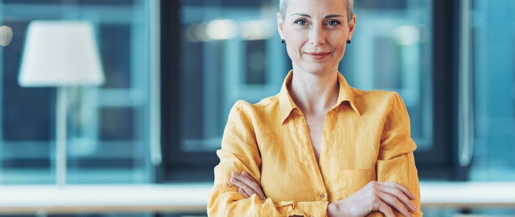 Smiling businesswoman standing in the office