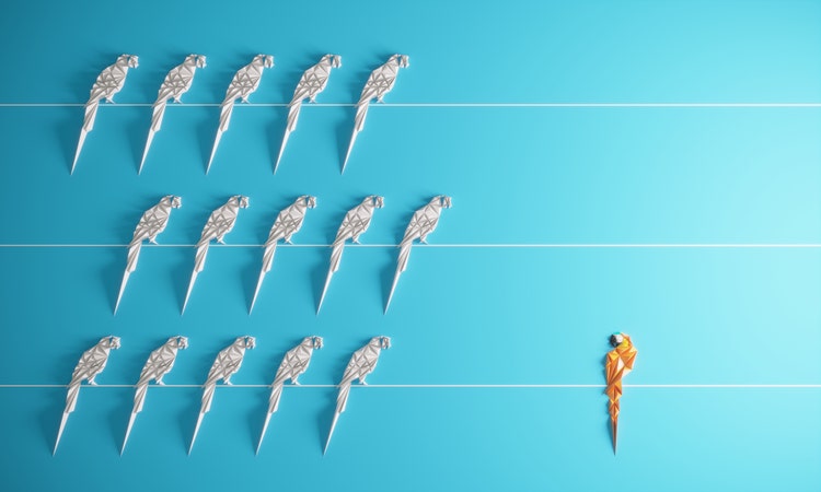 Group of abstract paper birds standing on a wire and with one individual standing in different side, can be used leadership/individuality concepts. (3d render)