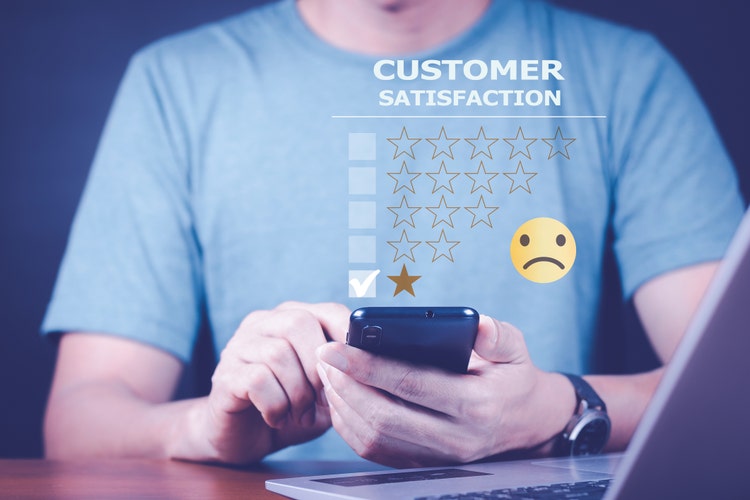 Customer Experience dissatisfied Concept, Unhappy Businessman Client with Sadness Face on smartphone screen, Bad review, bad service dislike bad quality, low rating, social media not good.