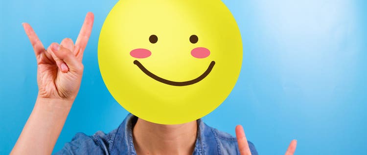 Unrecognizable woman with happy smiley instead of face