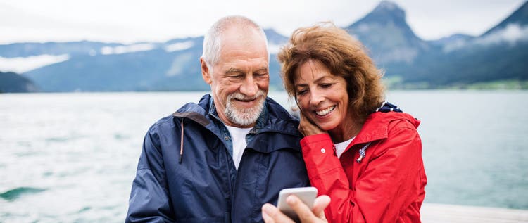 Old man and woman on a walk in summer, talking.