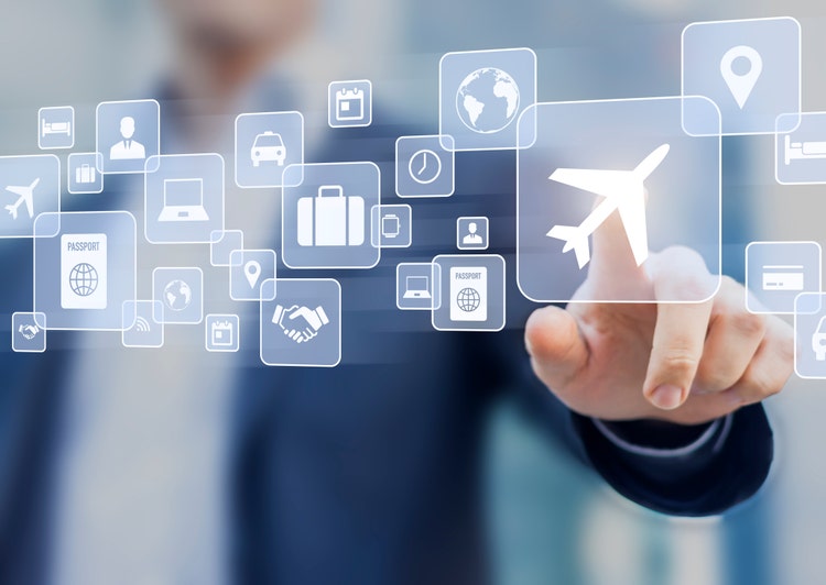 Business trip concept with a businessman touching a button on a screen with icons about travel planning, transportation, hotel, flight and passport