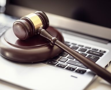 Justice gavel on laptop computer