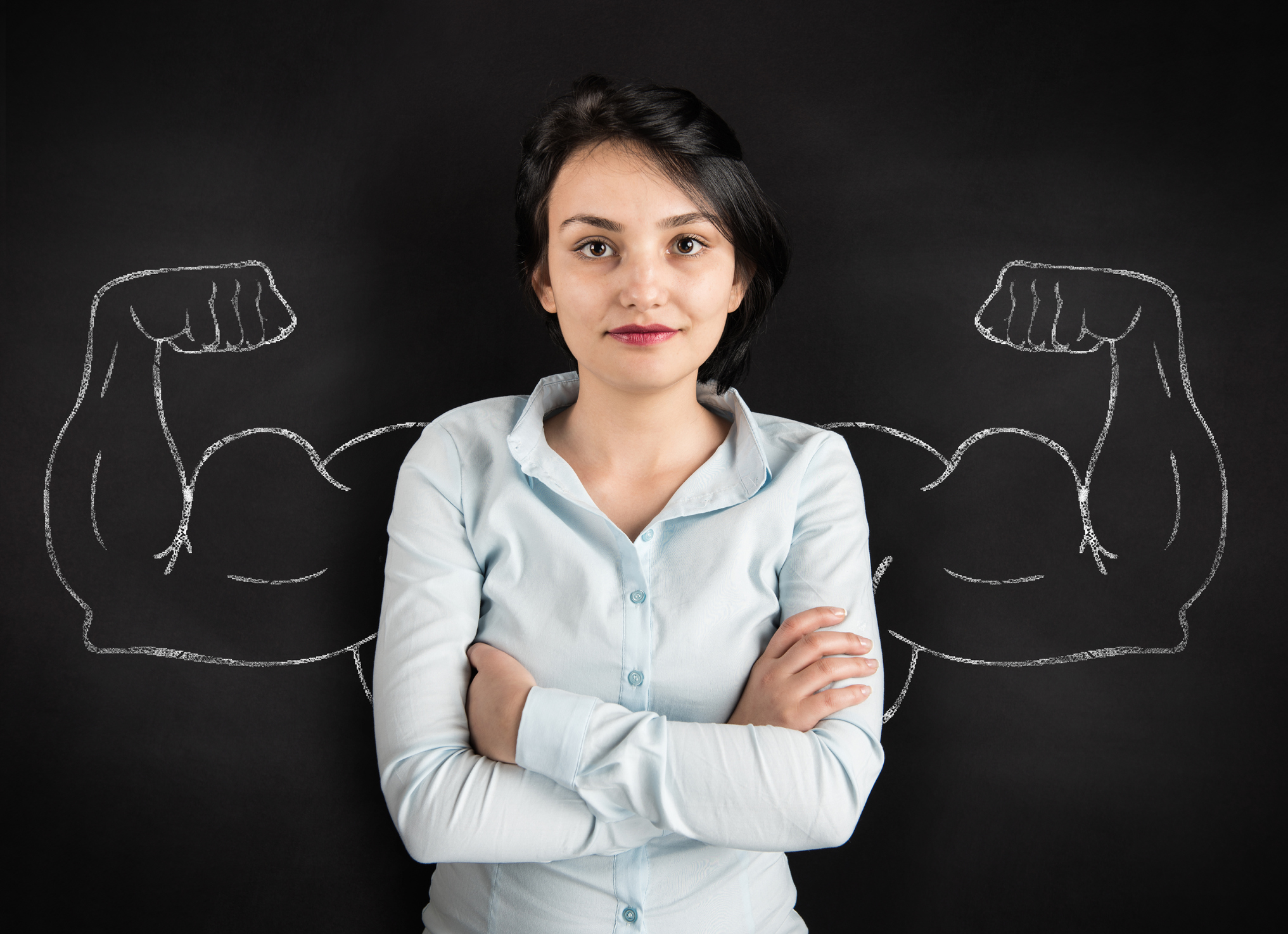 Young woman with drawn powerful arms high quality studio shot.