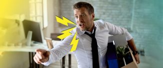 An upset employee holds a box with his things under one arm. He's talking loudly and gesturing with his free hand. Three yellow lightening bolts icons come out from his open mouth.