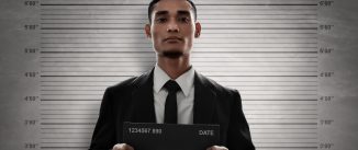 mugshot of man in a suit