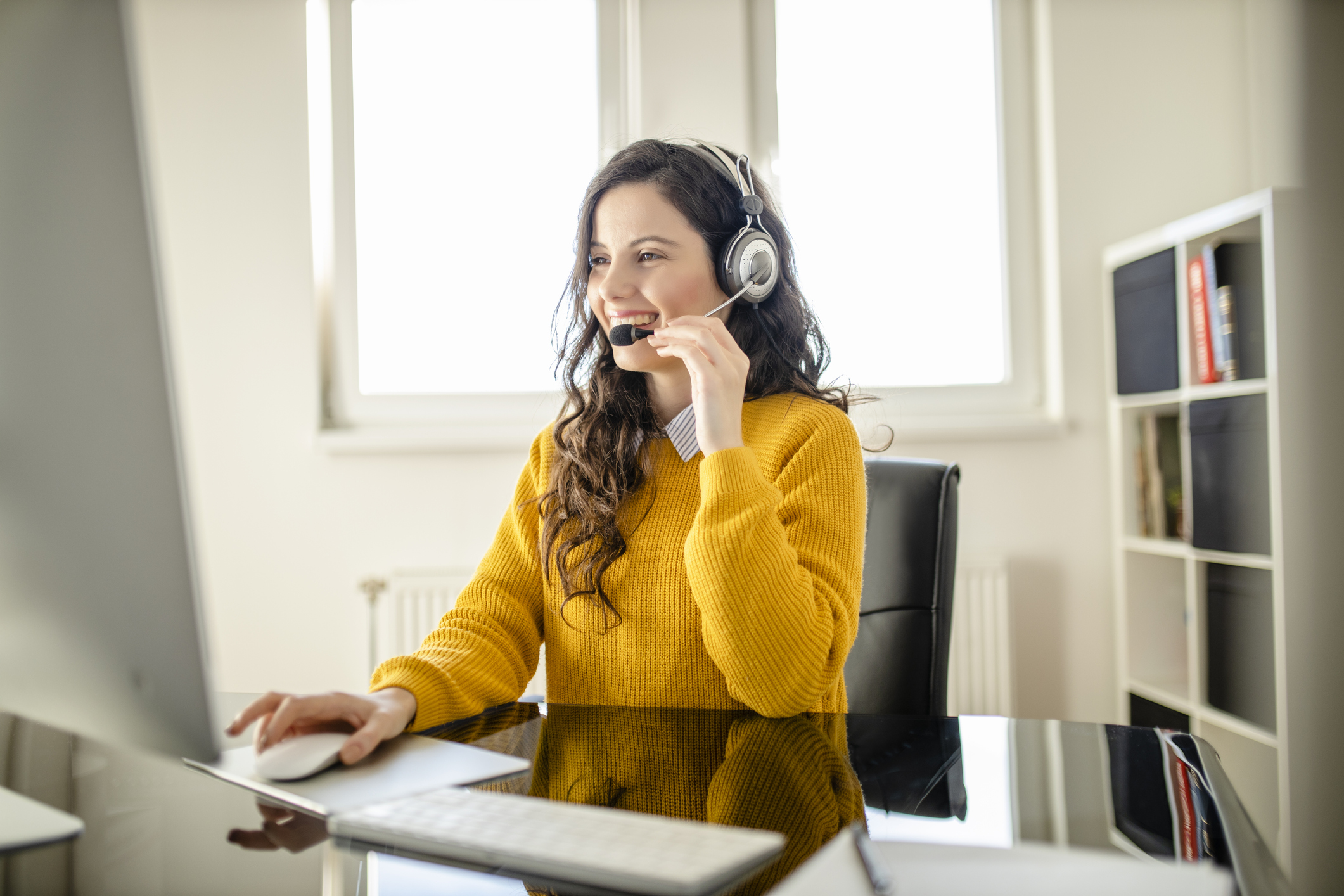 Smiling female psychologist wearing headset looking at camera. Remote online medical chat consultation, telemedicine distance services, virtual physician conference call concept