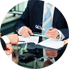 executive holding glasses