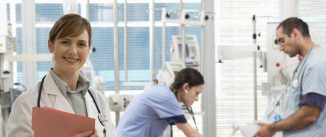 Doctors Working on Patient in Intensive Care Unit
