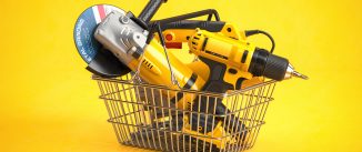 Shopping basket with elecric tools and construction equipment angle grinder, electric drill and jigsaw on yellow. Selling and buying online. 3d illustration