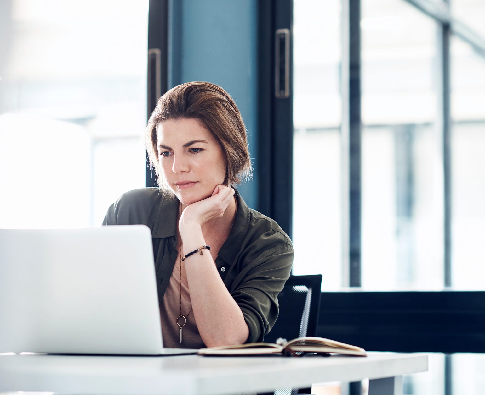 woman concentrating on a laptop screen