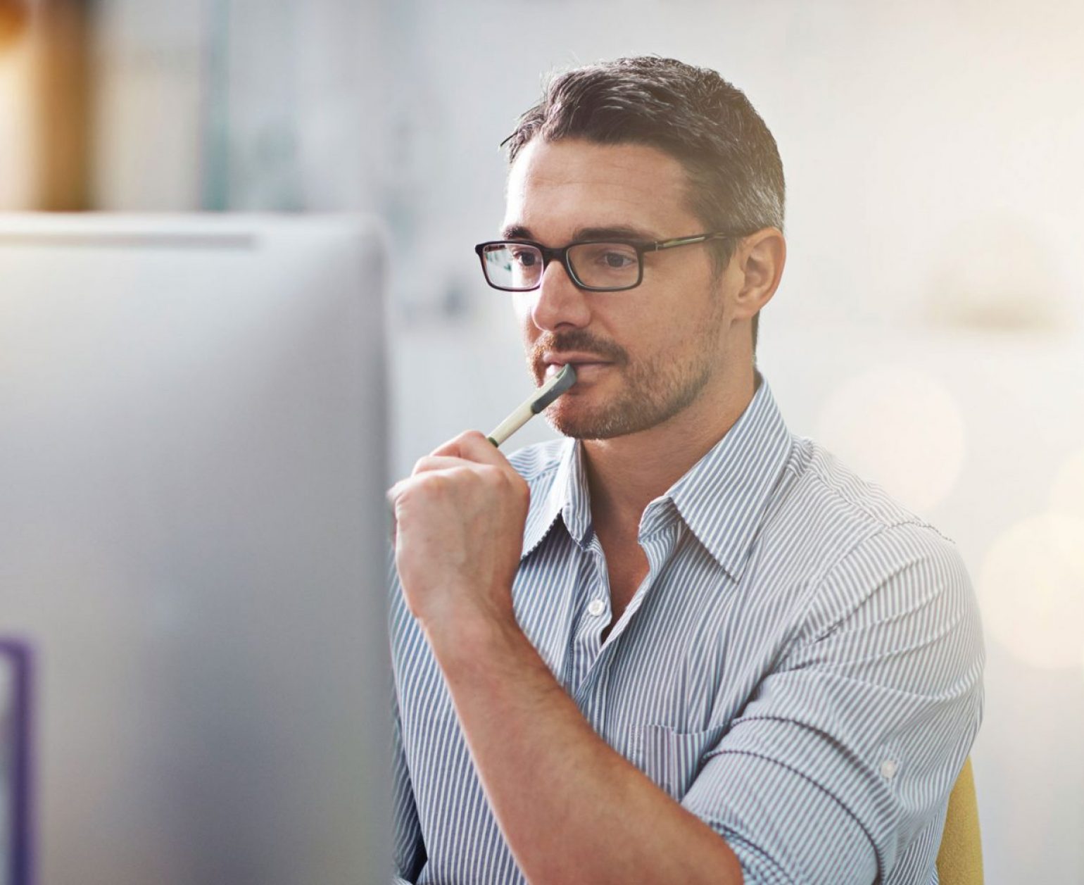 pensive man at the computer