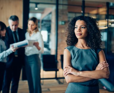 Beautiful African-american ethnicity woman sitting confidently in office looking away
