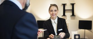 Receptionist at reception desk