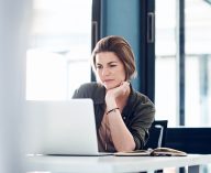 woman concentrating on a laptop screen
