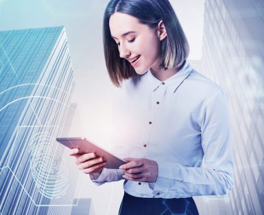 a woman looking at a tablet computer