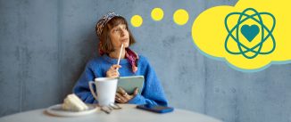 A woman sitting at a table with coffee and cake, with a yellow thought bubble coming from her head with a heart icon inside a series of rings.