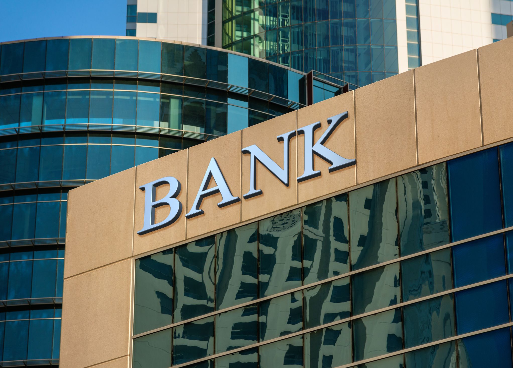 Bank sign on glass wall of business center