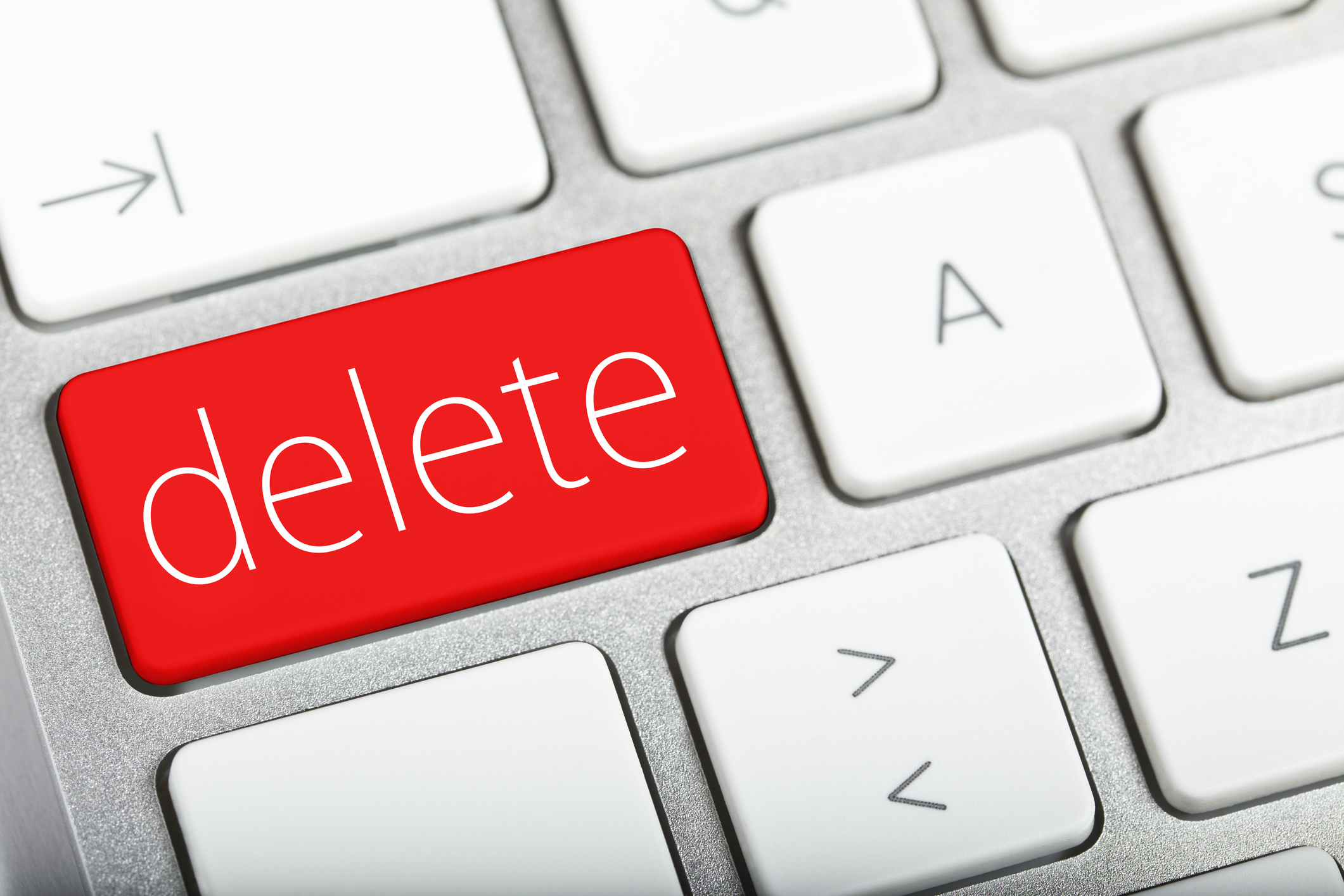 Closeup of a red delete key on a keyboard.