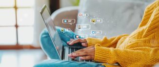 African American teenage woman using a smartphone ,Laptop with Icon communication network social media network pop notification concept.
