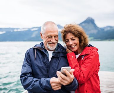 Old man and woman on a walk in summer, talking.